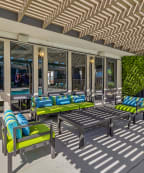 our apartments have a large swimming pool and a patio with chairs